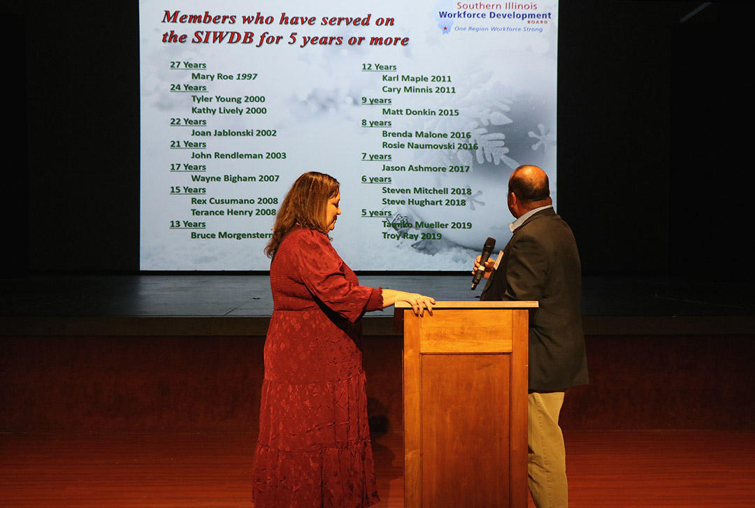 Youth Program Coordinator Jo Dene Kern and Career Specialist Justin Dodd welcome students to the ManTraCon table.