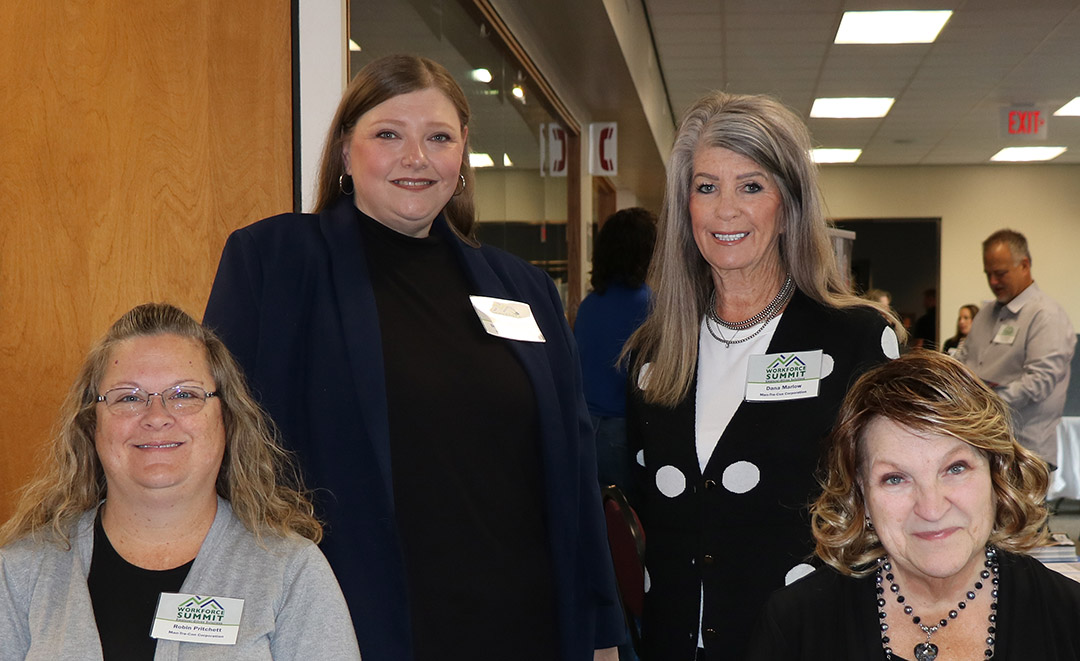 Man-Tra-Con staff welcome attendees to the workforce summit. 