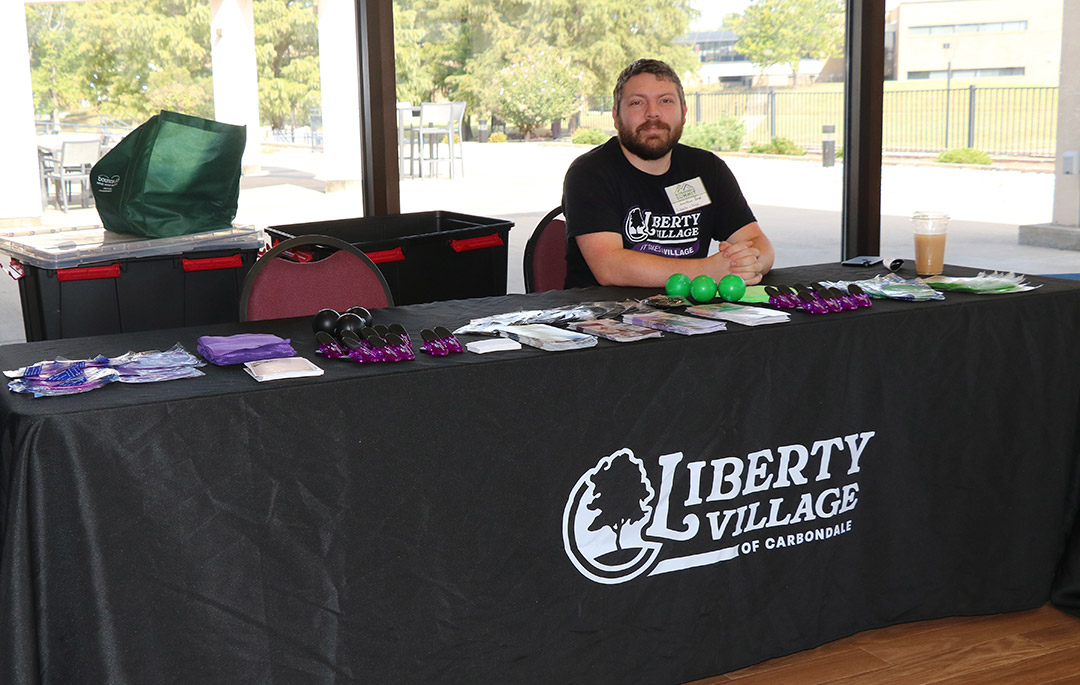 Jonathan Reed from Liberty Village of Carbondale welcomes attendees at the summit.